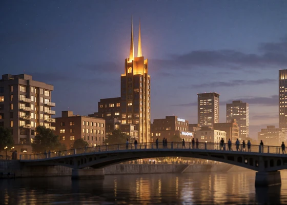 Nashville riverfront skyline at dusk with a twin-spired illuminated tower and a pedestrian bridge over the river